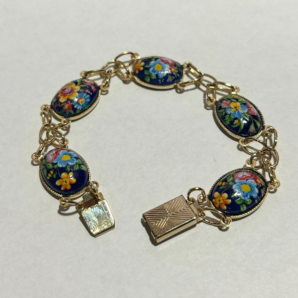 FIVE STATION ENAMEL & BRASS, SIZE 7, FLOWER MOTIF BRACELET
